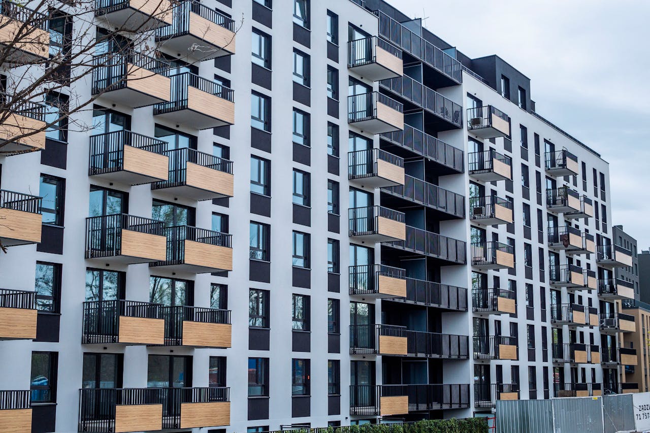 The Art of Drawing Readers In: Your attractive post title goes here Contemporary apartment building with balconies in urban setting, showcasing modern architecture.