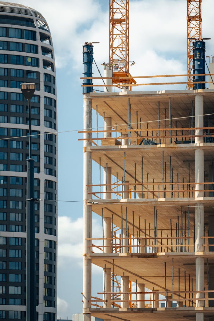 Mastering the First Impression: Your intriguing post title goes here A vibrant cityscape featuring modern architecture and a building under construction in Bratislava.