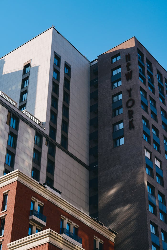 A view of contemporary high-rise buildings in Kyiv, showcasing modern architecture under a clear blue sky.
