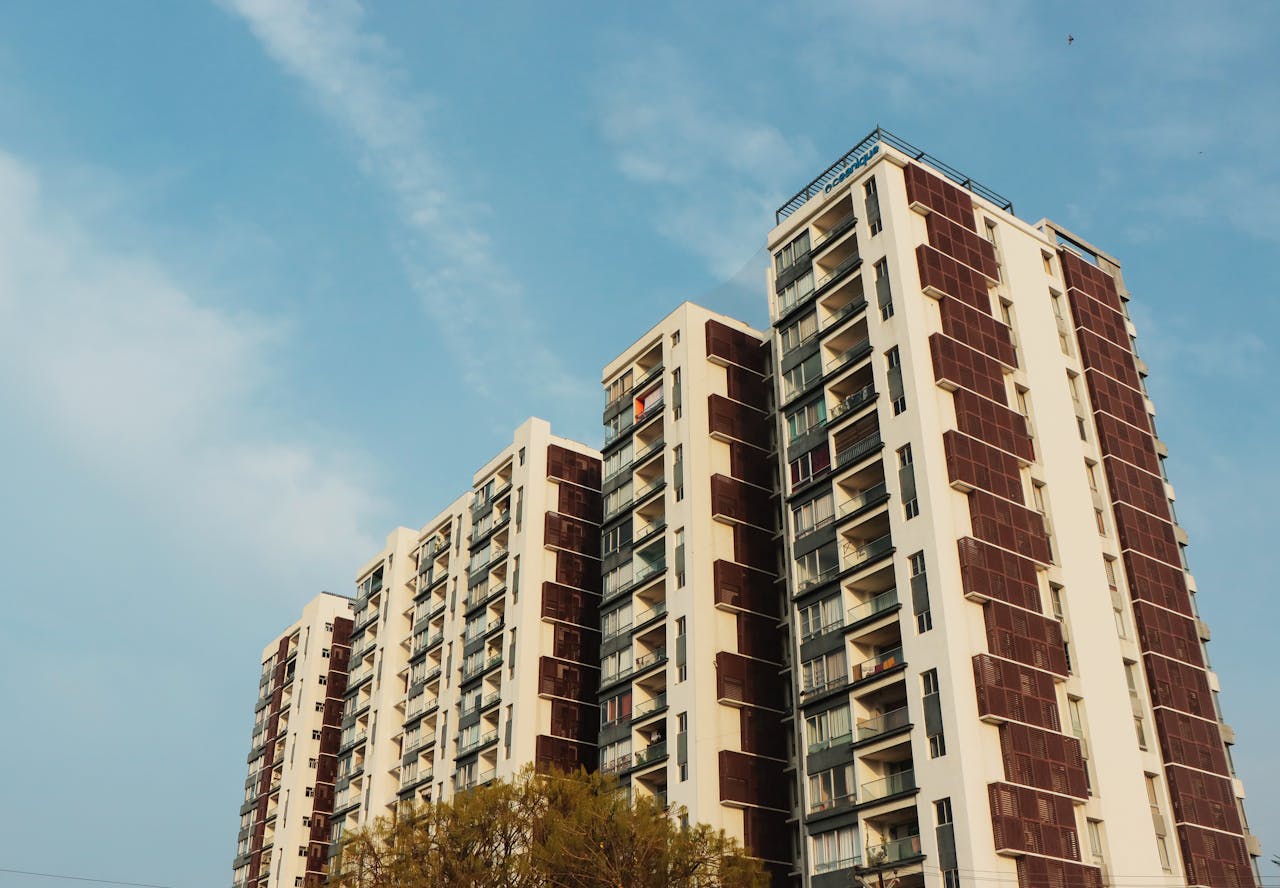 Crafting Captivating Headlines: Your awesome post title goes here A striking high-rise apartment building set against a clear blue sky, showcasing urban architecture.